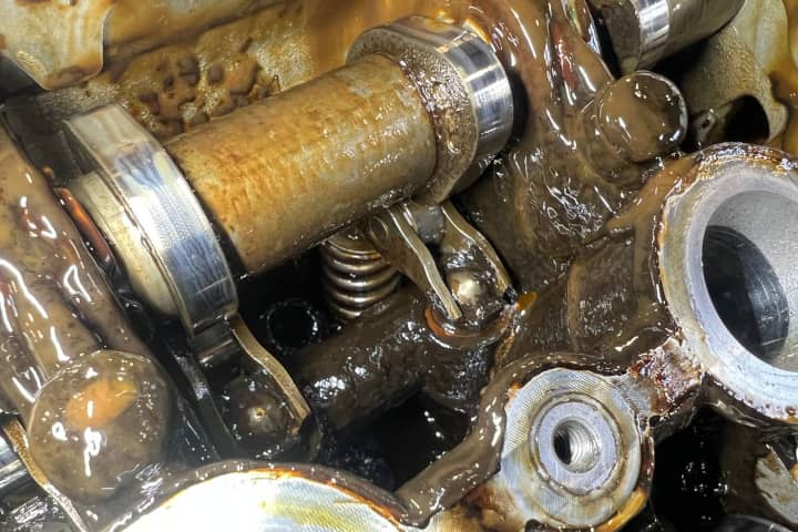 2013 Audi S5 engine oil sludge caused by not changing the engine oil and a head gasket leak