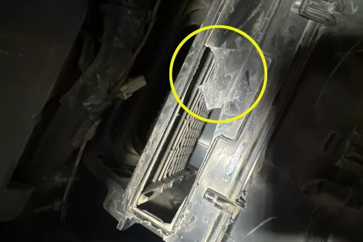 Damaged heater housing which allowed warm air to escape and not exit for defroster vents.